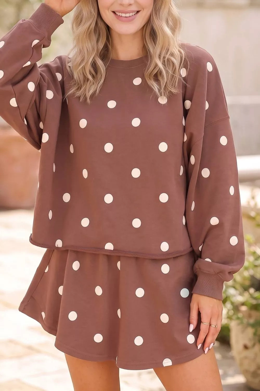 Women's brown polka dot two piece set with sweatshirt and raw hem shorts