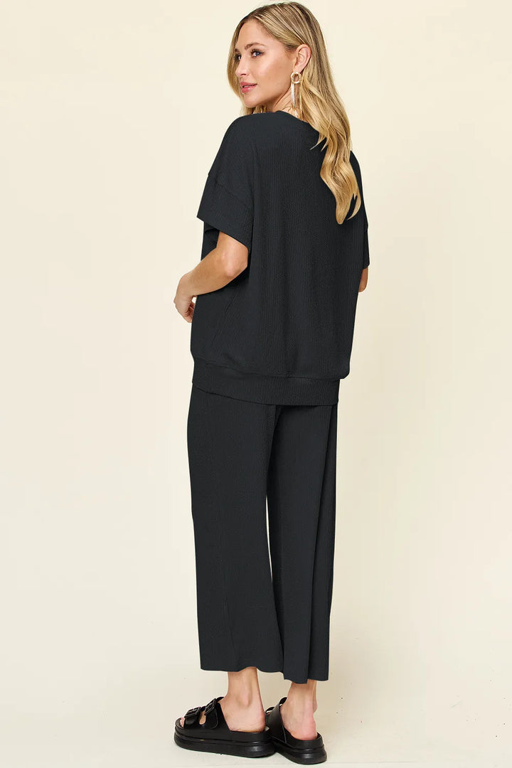 Back view of the black two piece set, looking over the shoulder