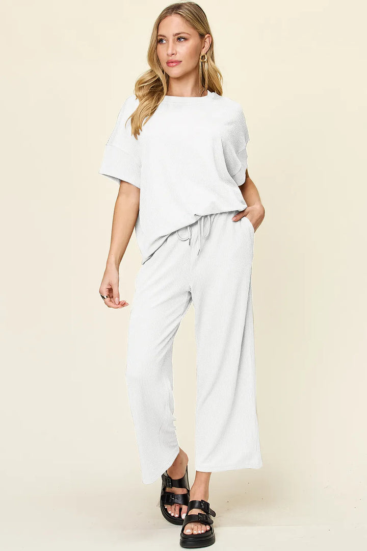 White short sleeve top and cropped pants, side angle with chunky sandals