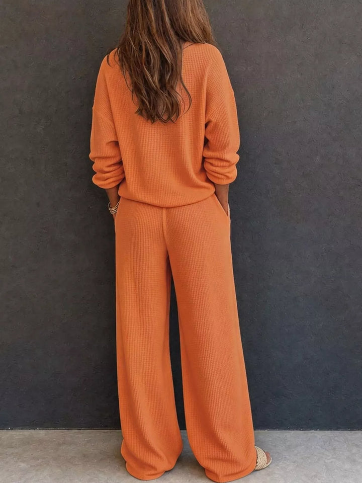 Back view of the orange waffle knit henley and wide leg pants set