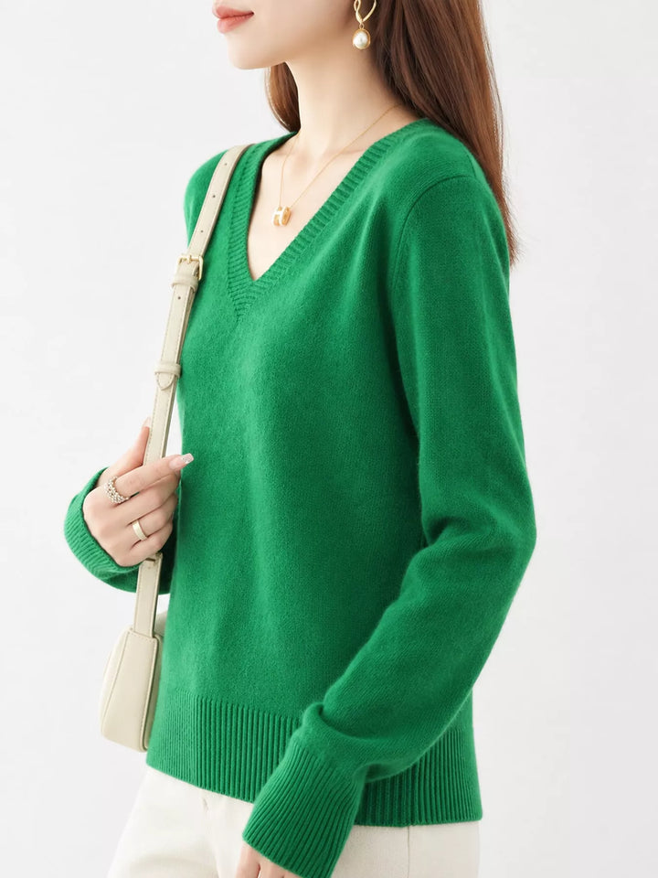 Emerald Green V neck sweater worn on-model, side angle with a relaxed fit