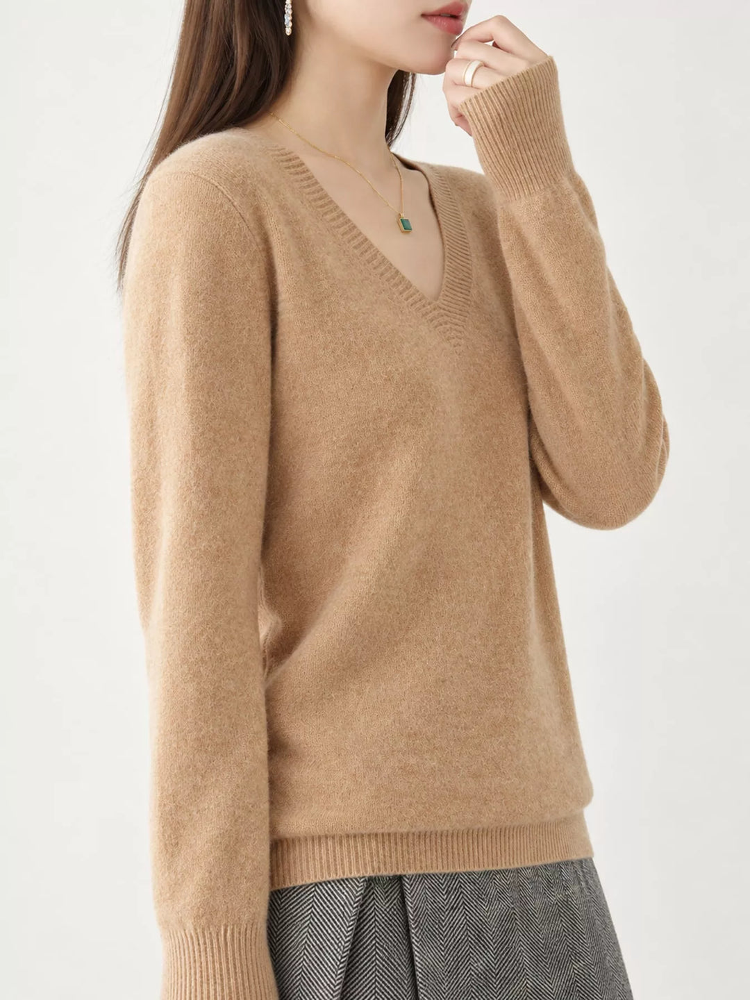 Golden Camel V neck sweater worn on-model, side angle with a relaxed fit