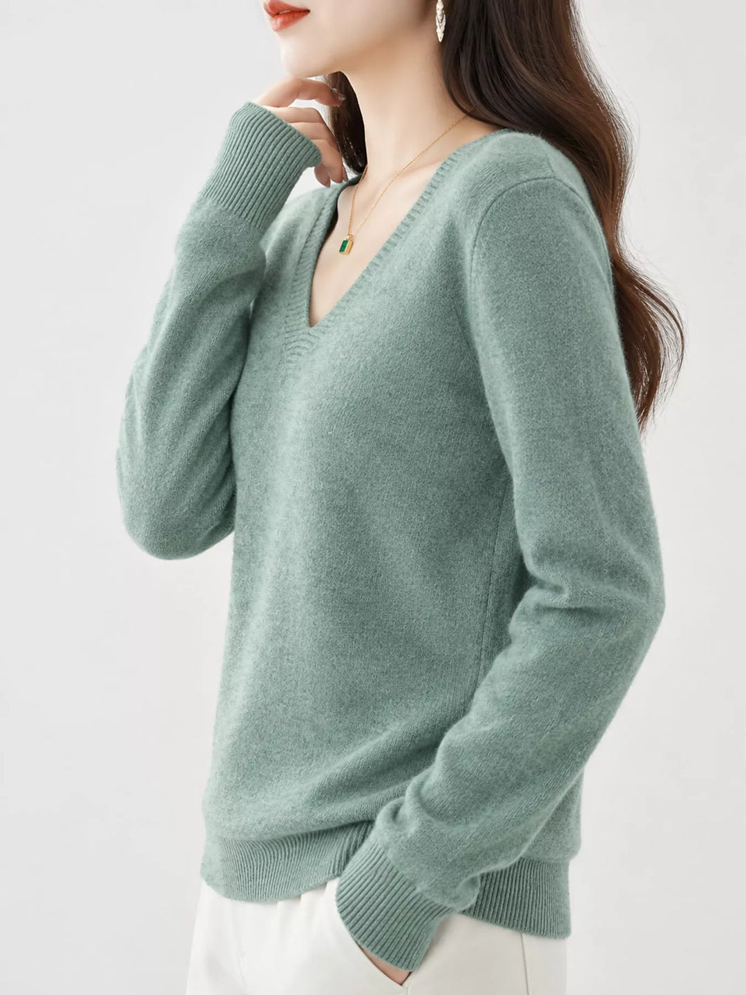 Leaf Green V neck sweater worn on-model, side angle with a relaxed fit