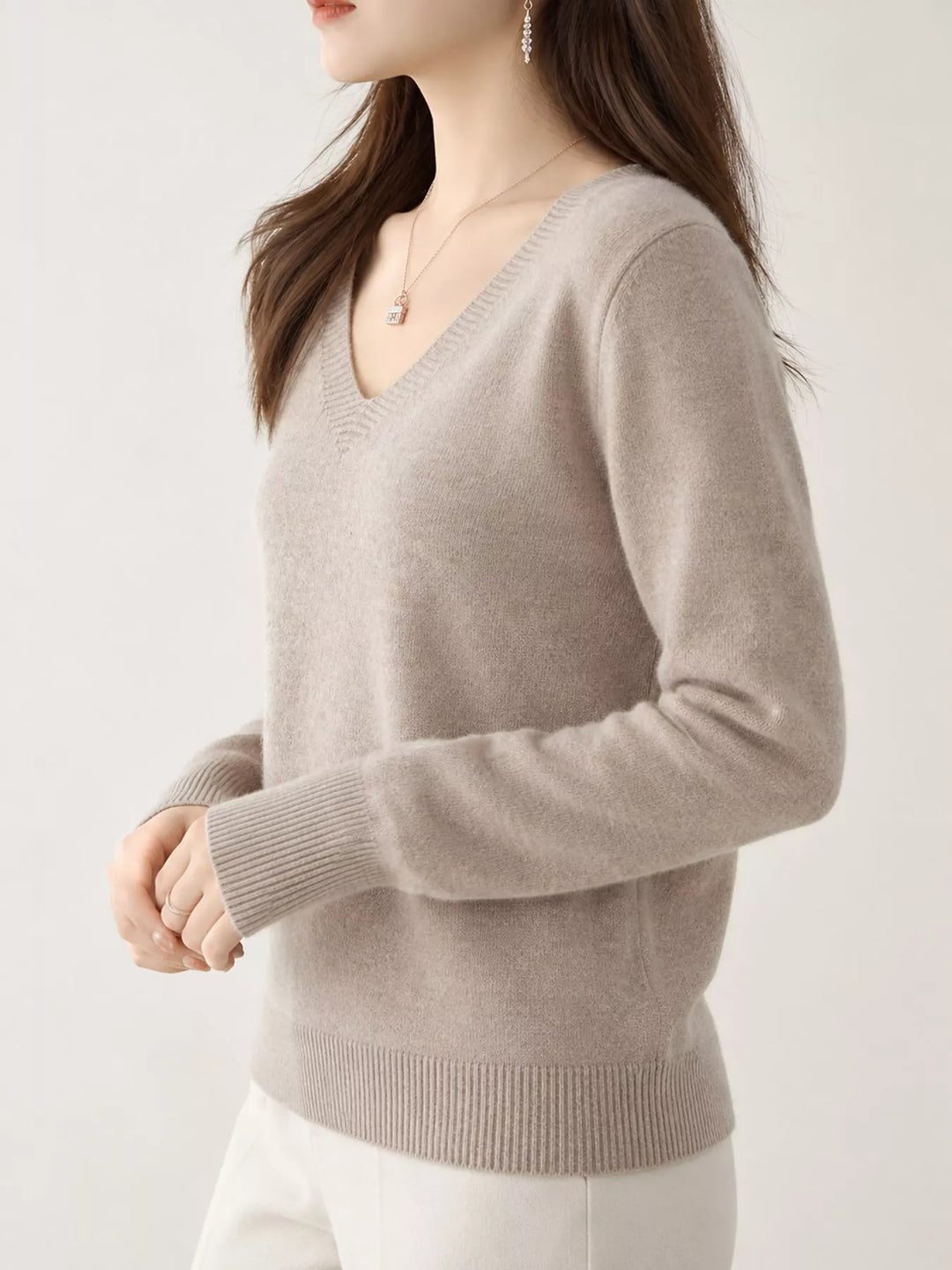 Light Camel V neck sweater worn on-model, side angle with a relaxed fit