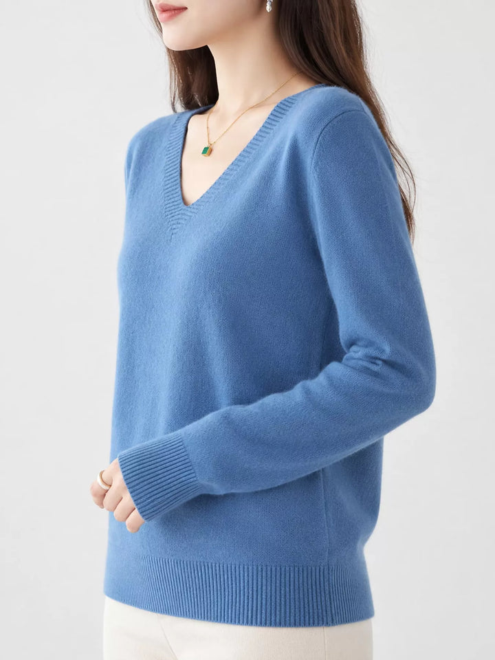 Misty Blue V neck sweater worn on-model, side angle with a relaxed fit