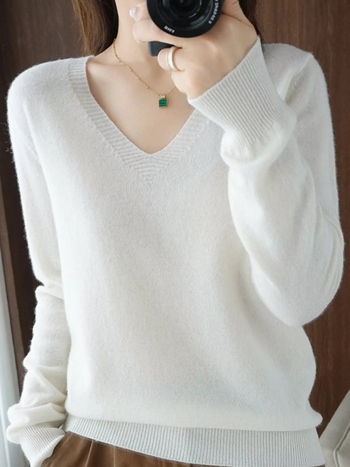 Women's V neck sweater in white, on-model front view with long sleeves