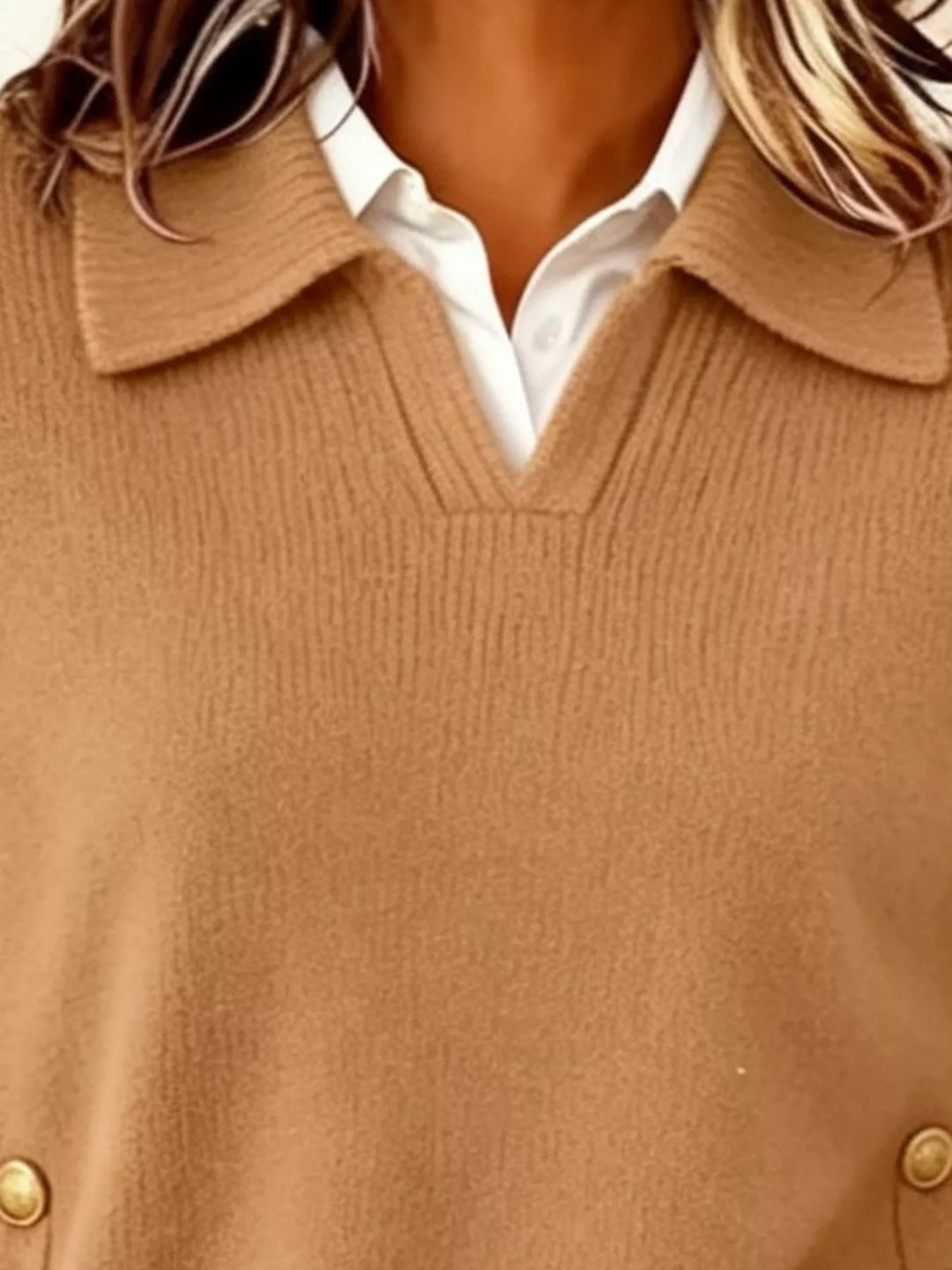 Polo collar gold-tone side buttons in orange-red, close-up detail