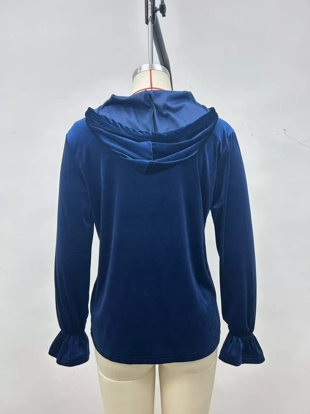 Navy blue velvet jacket back view with hood and ruffled cuffs