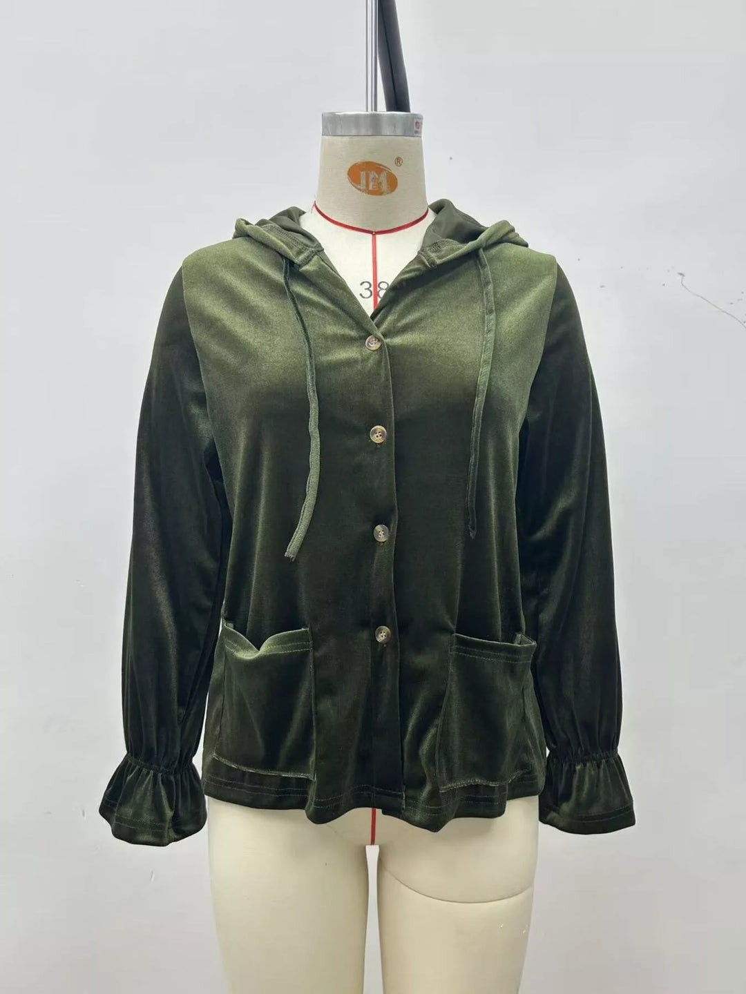 Olive green hooded velvet jacket front view with button placket and ruffled cuffs