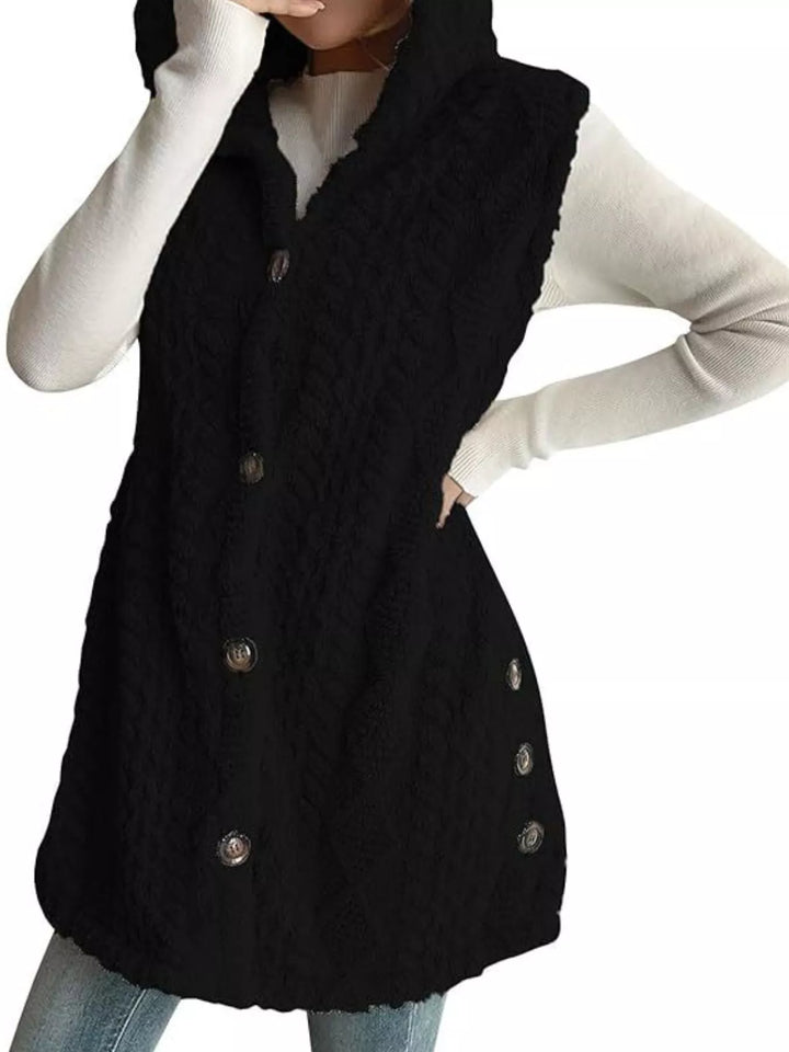 Black fuzzy cable knit vest with side buttons along the hem, cropped view
