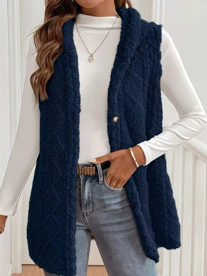 Navy fuzzy knit vest front view with a belted waist and open placket
