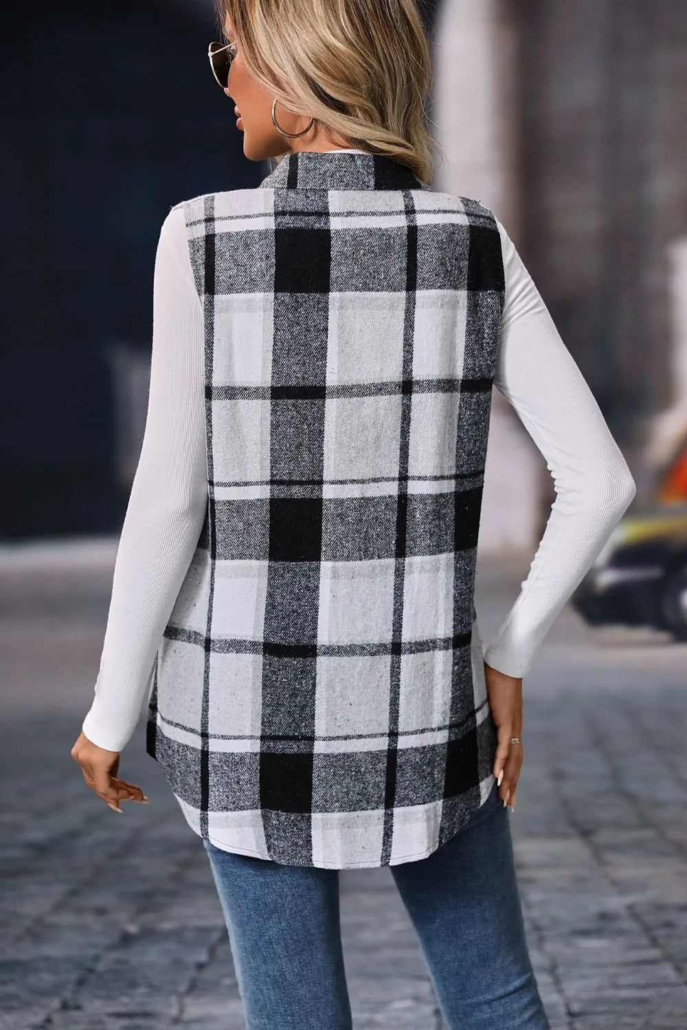 Back view of the black and white plaid longline vest