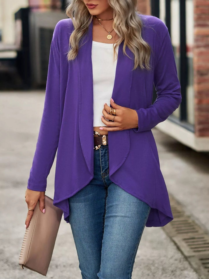 Full length view of the purple high low hem cardigan with blue jeans