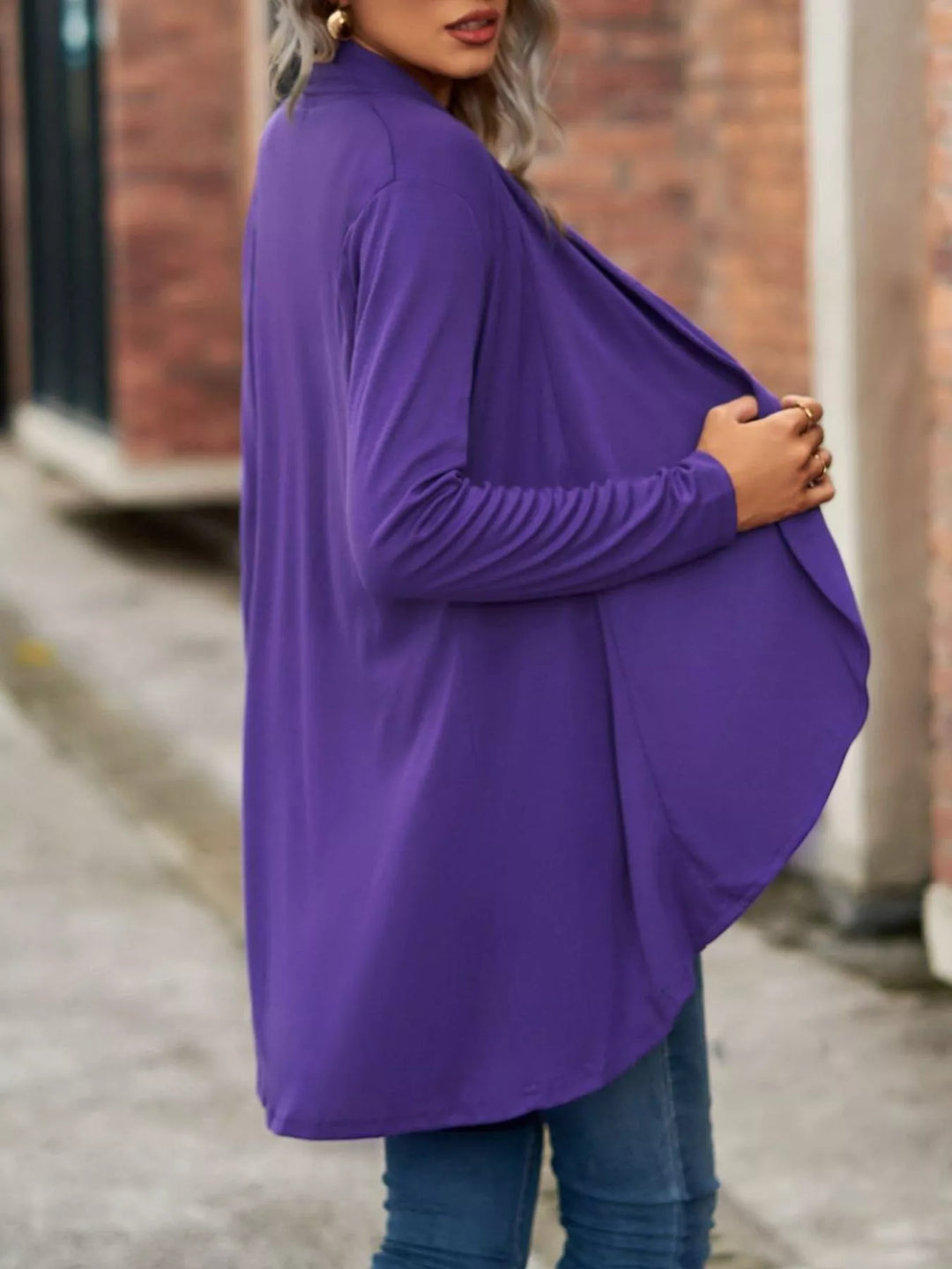 Side view of the purple waterfall cardigan draping softly at the front
