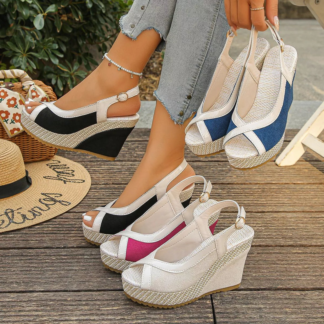 Women's wedge sandals in several colors, peep toe platform slingback pairs on wood deck