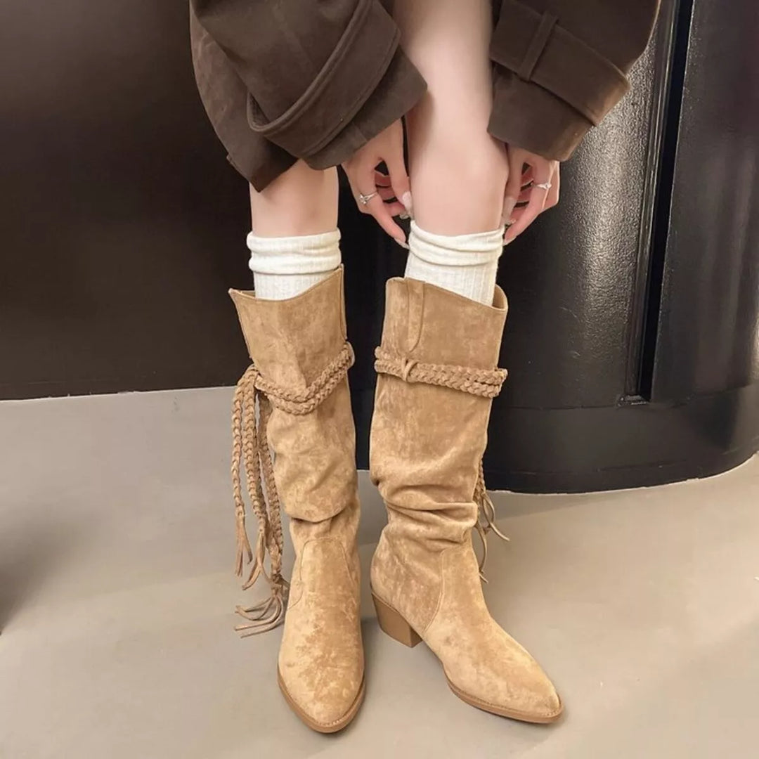 Camel slouch boots with braided rope detail worn with brown trousers and white socks