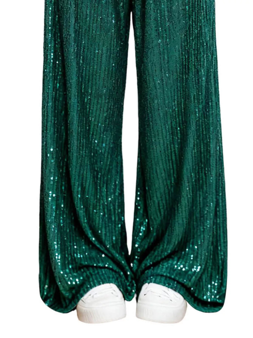 Emerald sequin wide leg pants hem over white sneakers