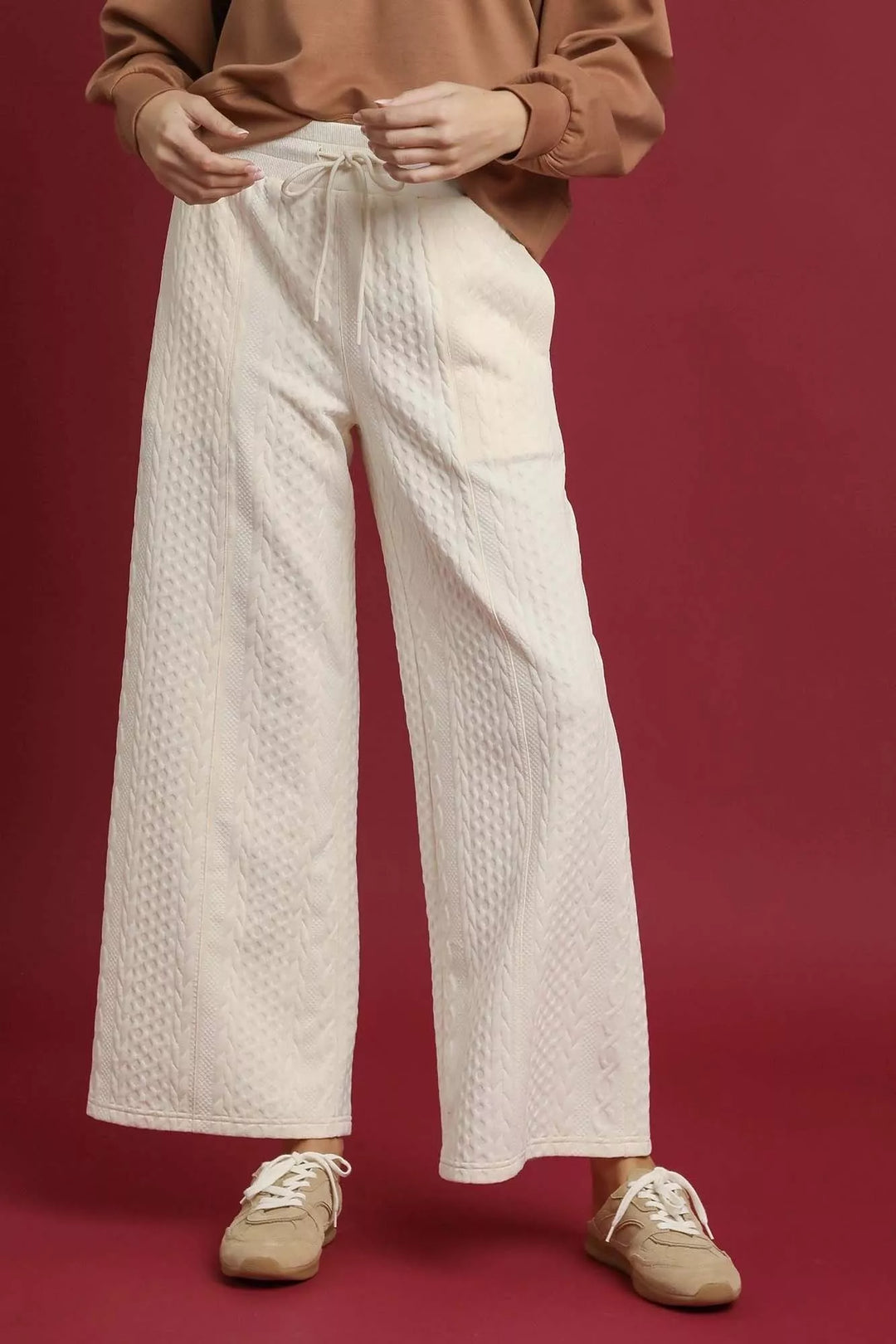 Women's ivory wide leg pants with cable knit texture, ankle length front view
