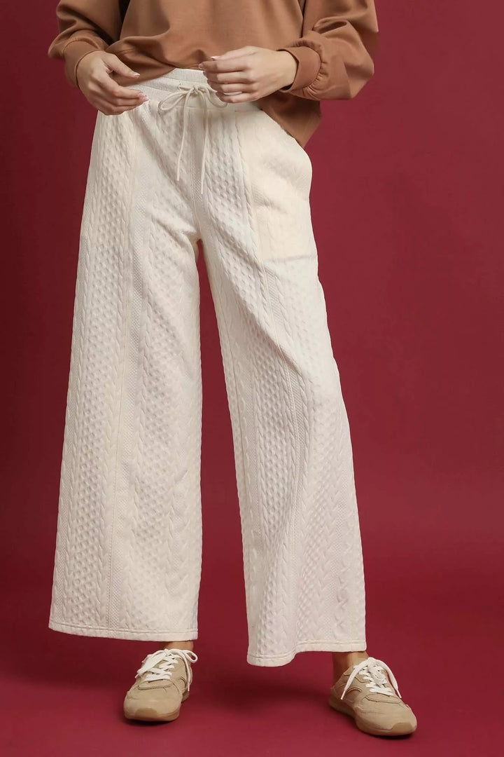 Women's ivory wide leg pants with cable knit texture, ankle length front view