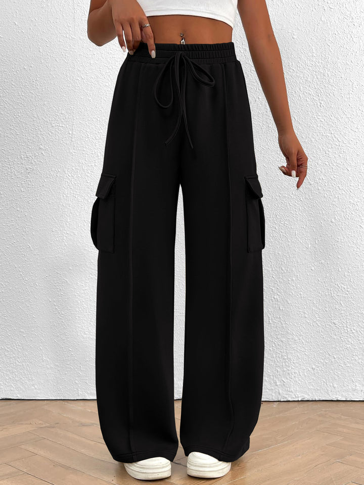 Black wide leg cargo pants with high waist and drawstring, front view