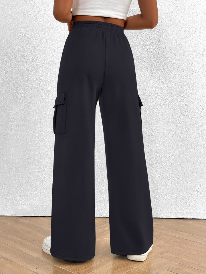 Back view of the women's charcoal high waisted wide leg cargo pants