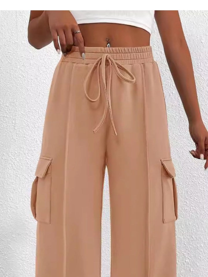 Close-up of the women's peach cargo pockets and drawstring waist