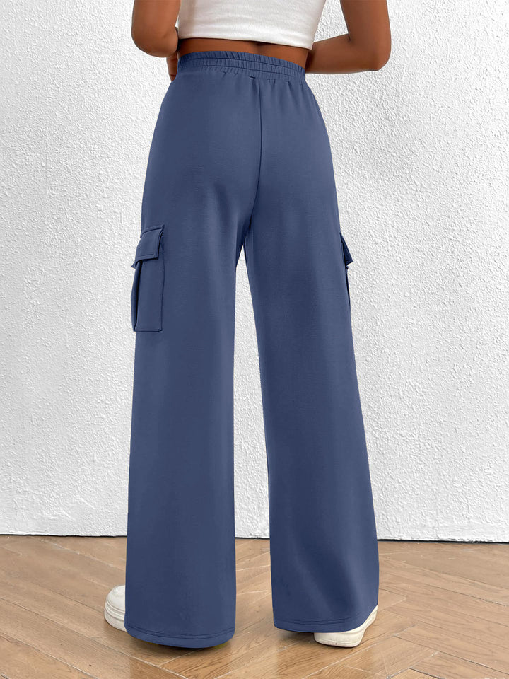 Slate blue wide leg cargo pants with high waist and drawstring, front view