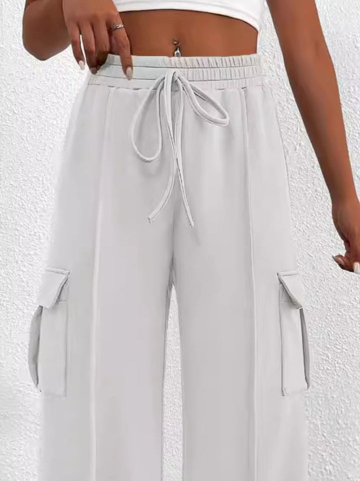 Close-up of the women's white cargo pockets and drawstring waist