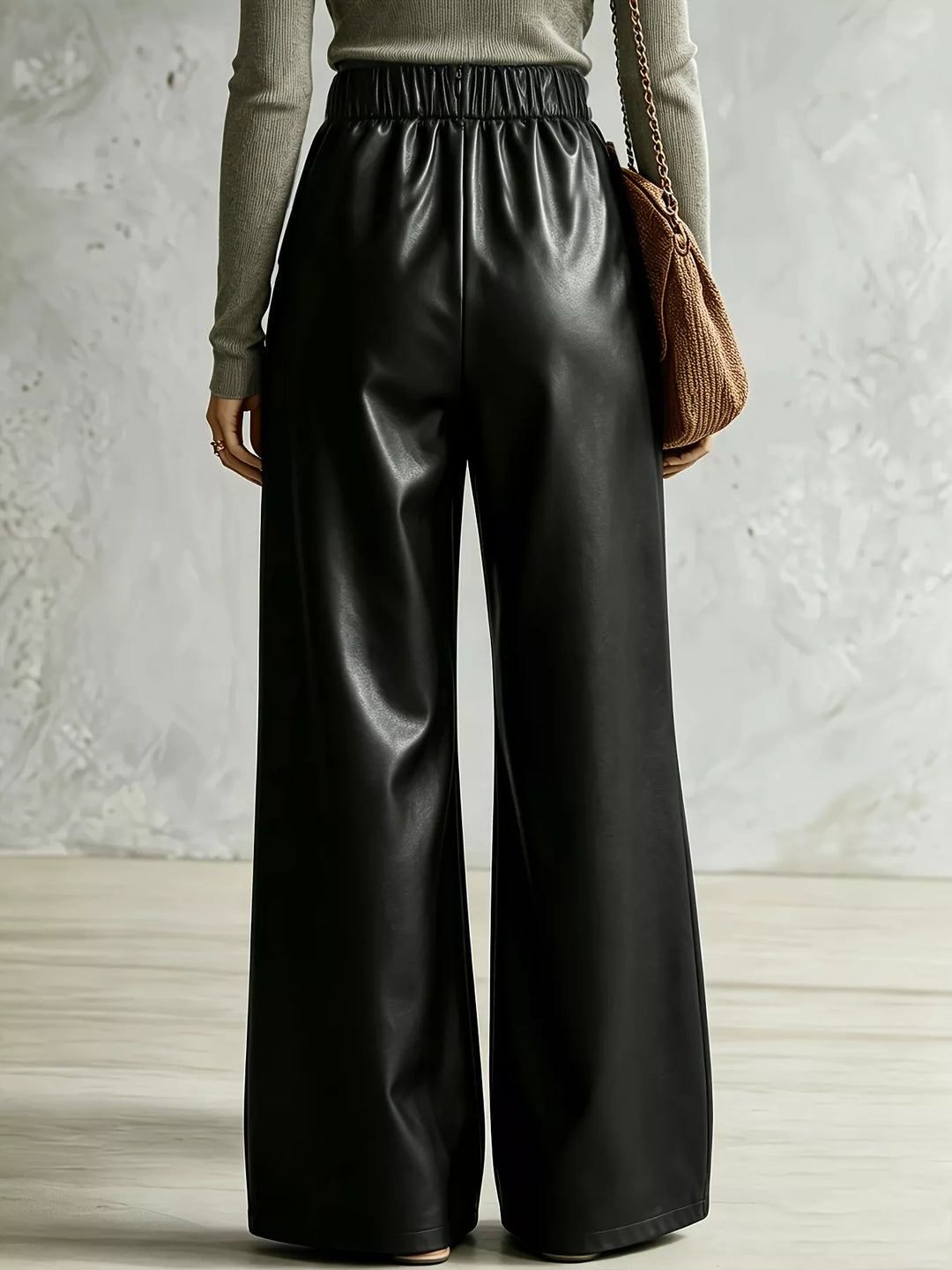 Rear view of black wide leg pants showing the elastic back waist