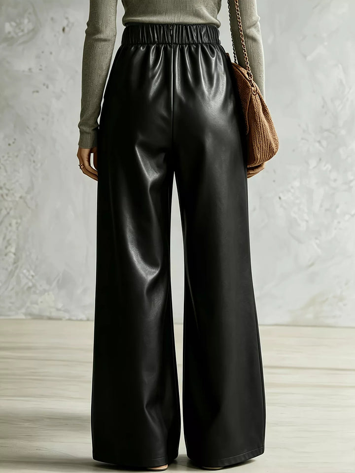 Rear view of black wide leg pants showing the elastic back waist