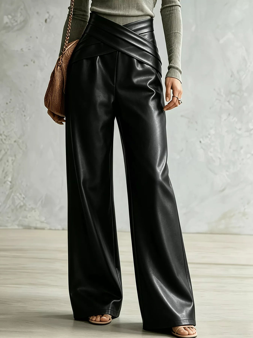 Black wide leg pants with crossover waist and high shine finish, front view
