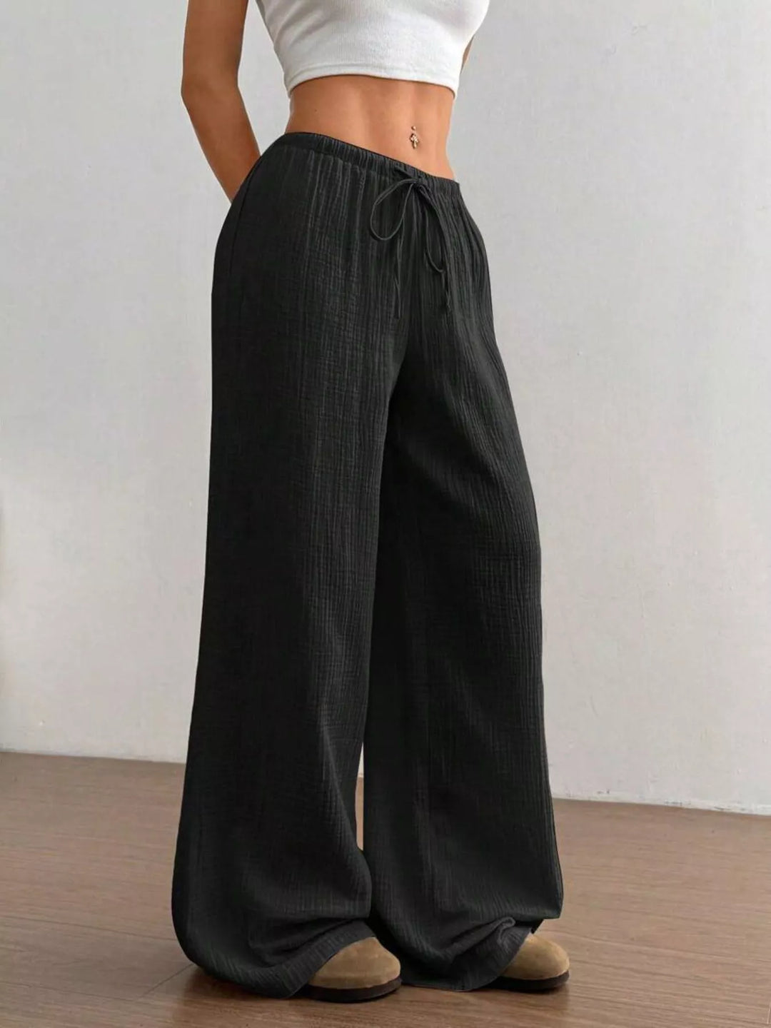 Full length black wide leg pants with drawstring tied at the front