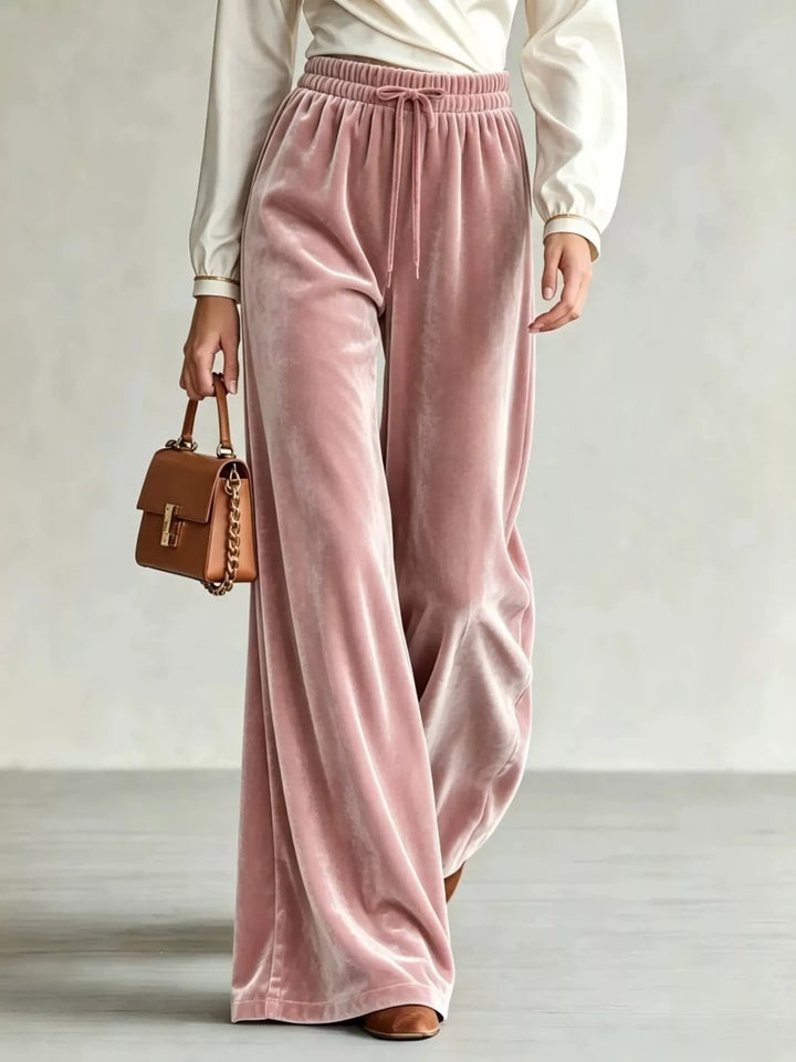 Women's dusty pink wide leg pants, drawstring velvet-look soft pile, with a brown handbag