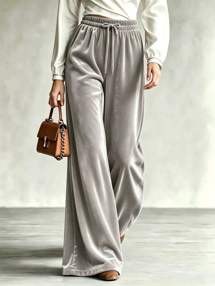 Gray velvet-look wide leg pants with drawstring waist, worn with a cream top