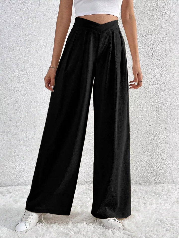 Black high waist wide leg pants with pleats, full length front view