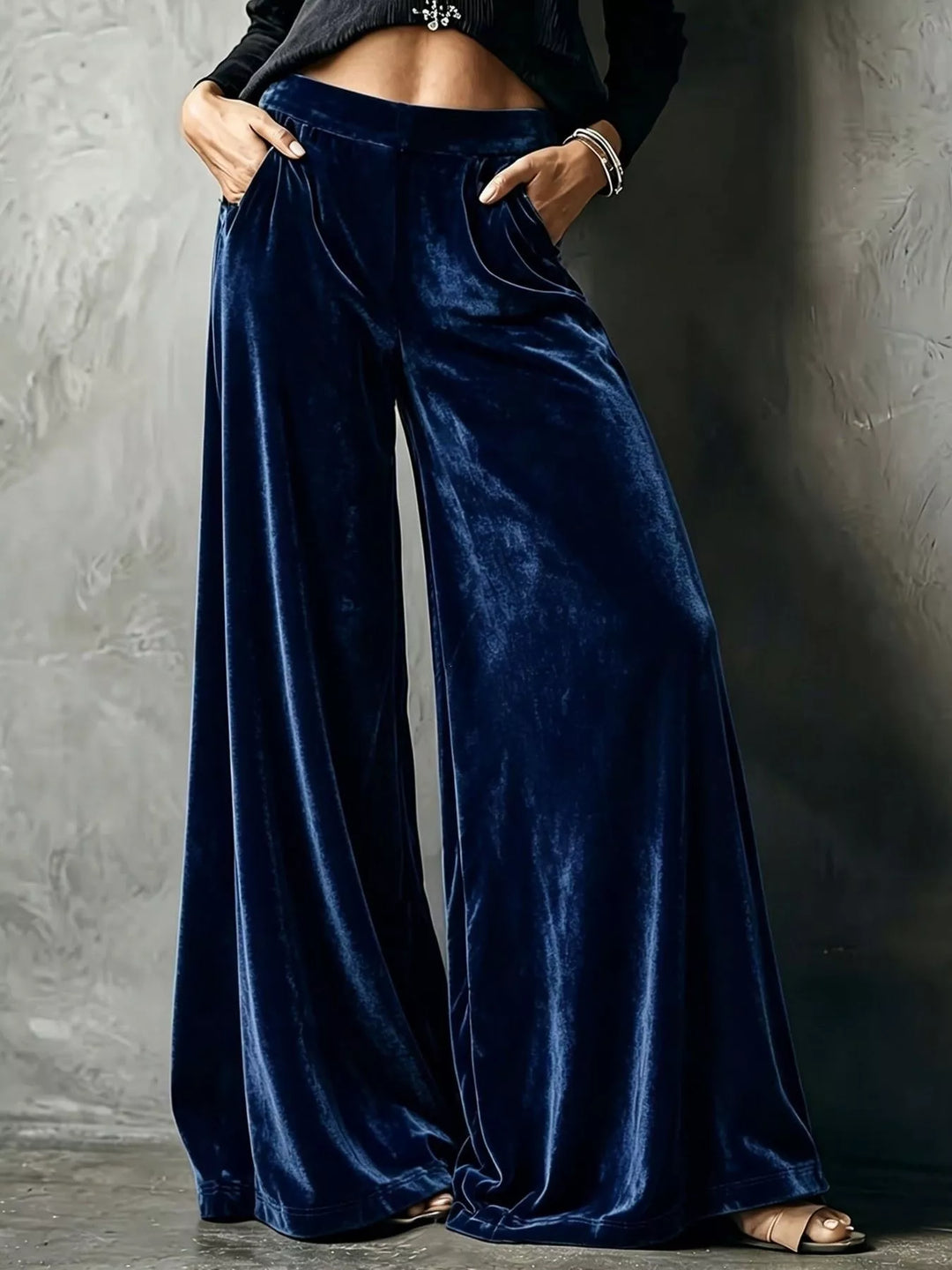 Navy wide leg pants with a high waist and glossy velvet-look sheen