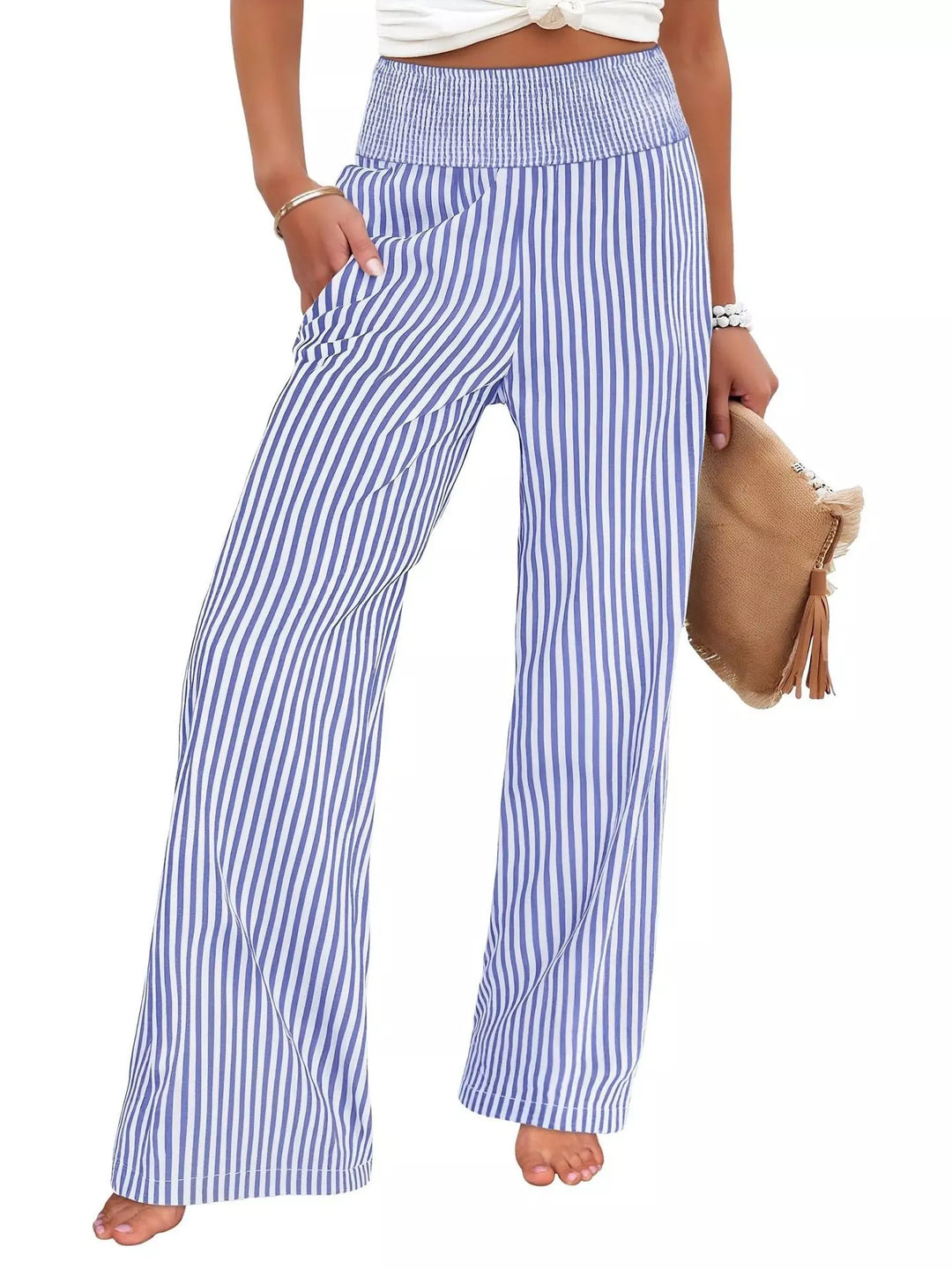 Blue high waisted striped wide leg pants, front view with a tan clutch