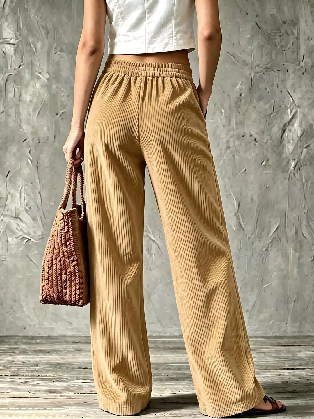 Back view of the khaki wide leg pants with elastic waistband