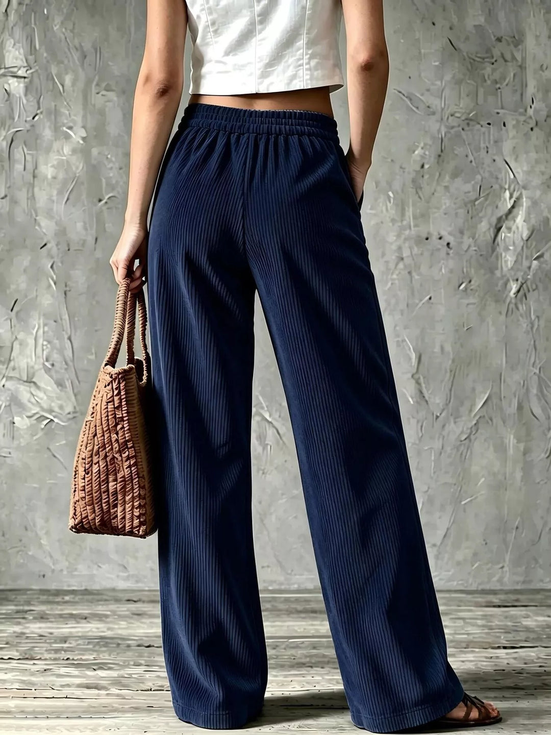 Back view of the navy wide leg pants with elastic waist