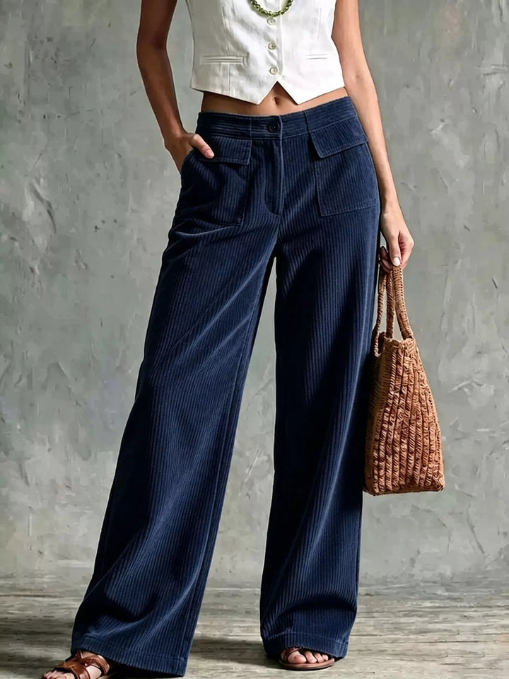 Navy wide leg pants with ribbed texture and flap pocket, front view
