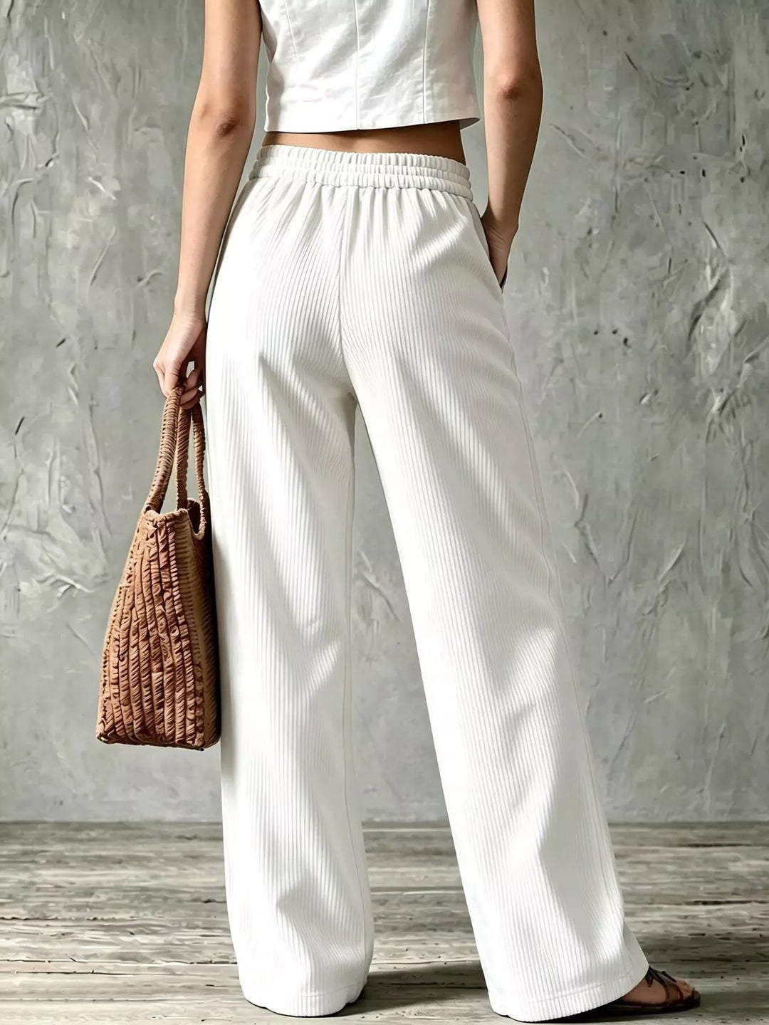Back view of the white wide leg pants with elastic back waist
