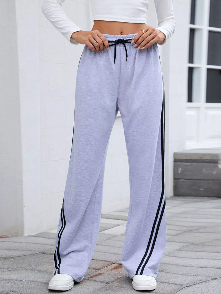 Lavender drawstring high rise pants, close-up from waist to knees
