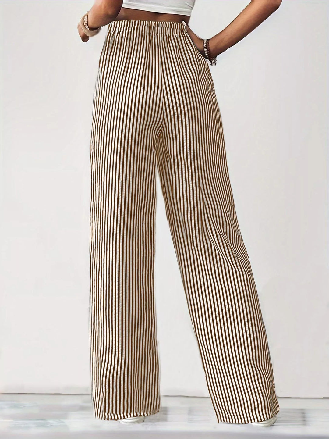 Beige pinstripe wide leg pants with elastic waist, full length view