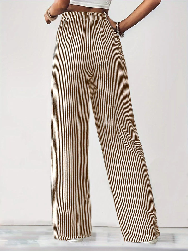 Beige pinstripe wide leg pants with elastic waist, full length view