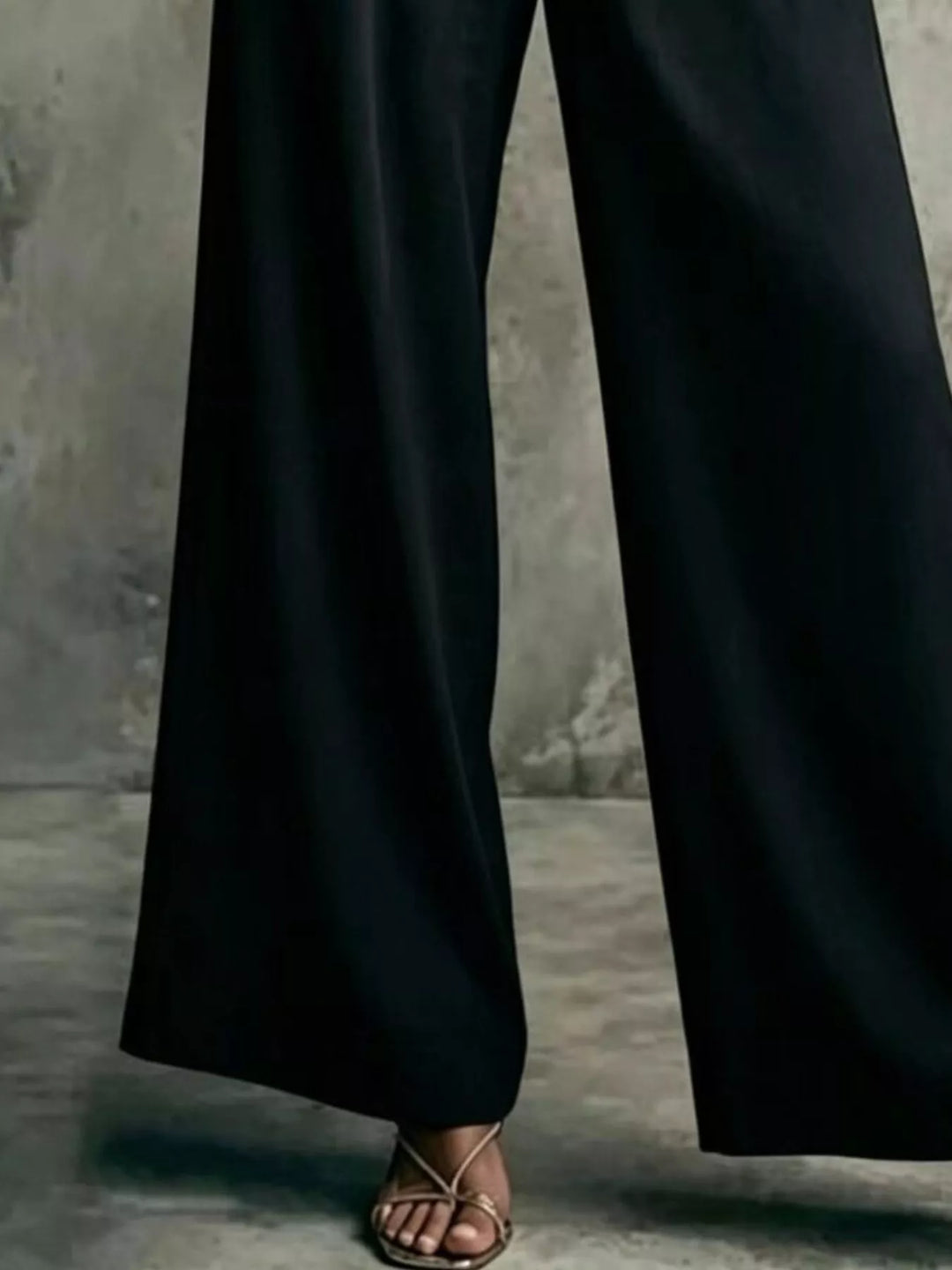 Black wide leg trousers, close-up of the long relaxed leg
