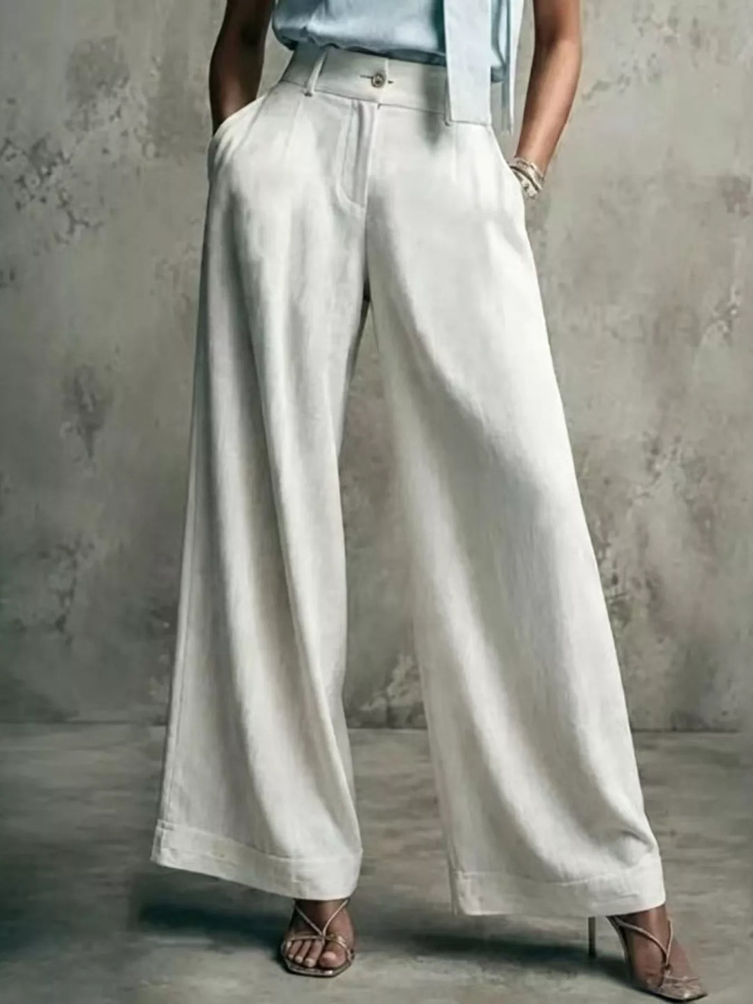 Women's wide leg trousers in white with a high waist and pleats
