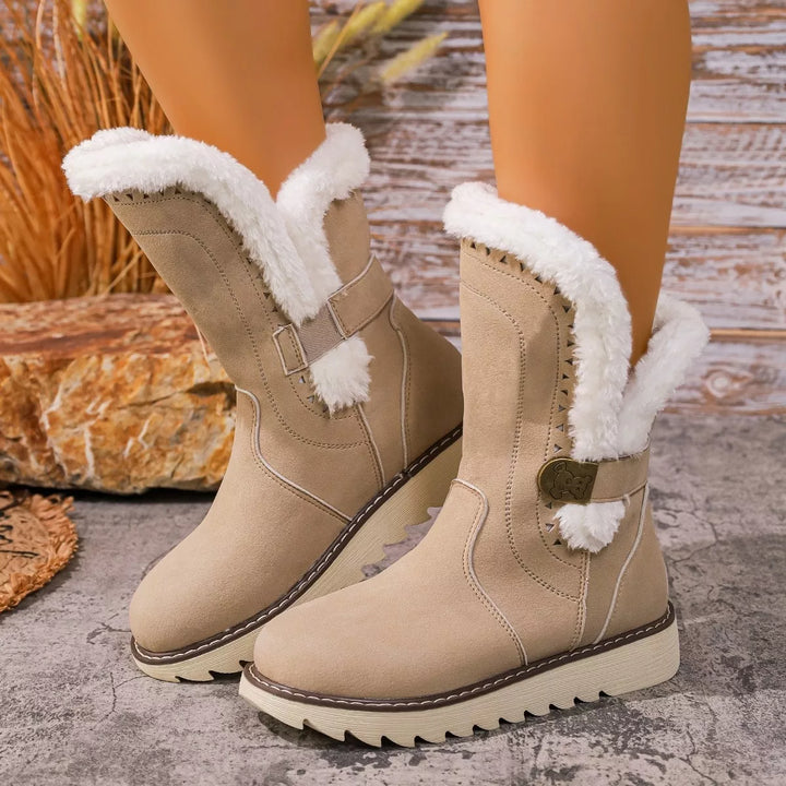 Beige mid calf winter boots with soft faux fur trim and a chunky sole