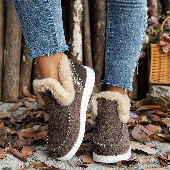 Coffee brown slip on ankle boots with plush collar worn with jeans