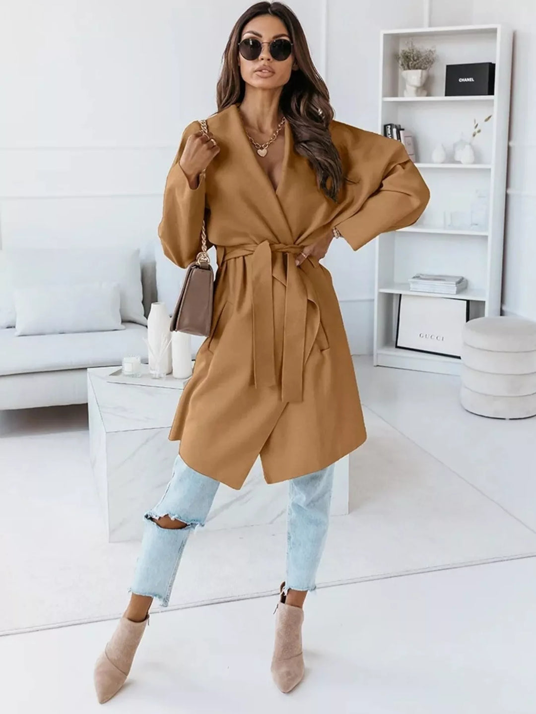 Full length look with camel belted coat, light jeans and nude ankle boots