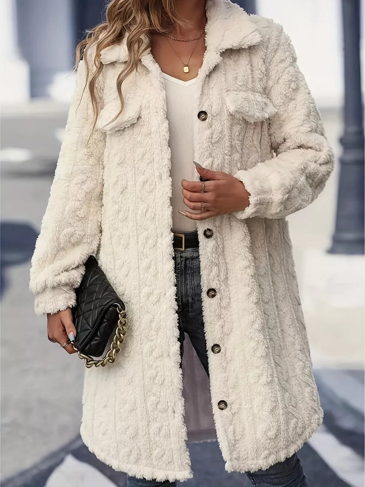Women's fuzzy longline winter coat in cream, front view with button front and collar